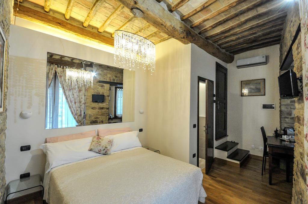 Case Brizi Asís Habitación foto