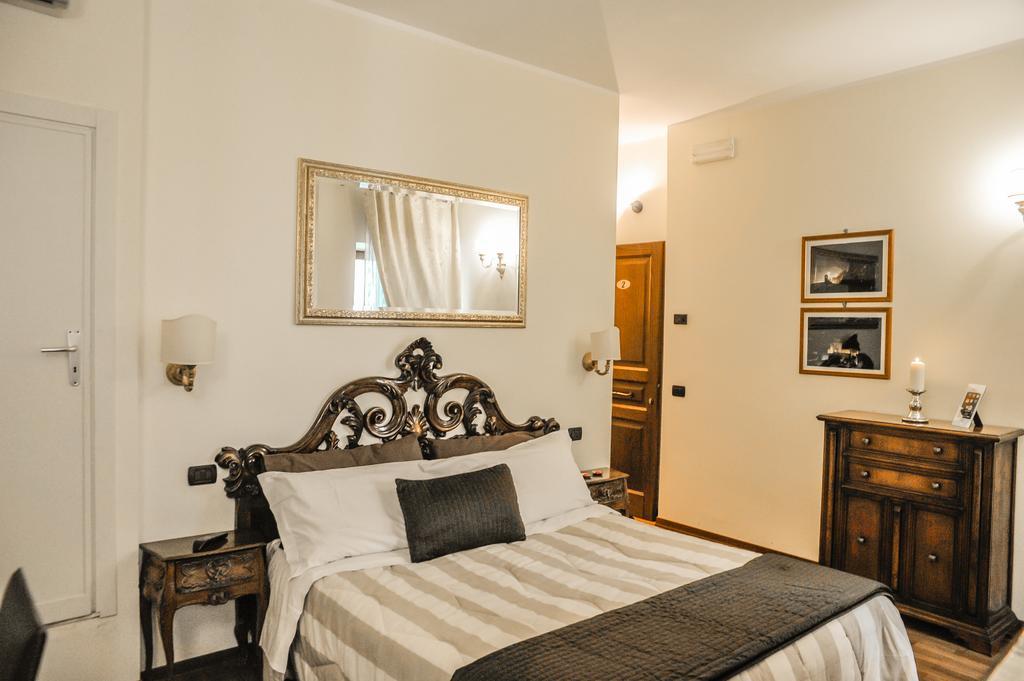 Case Brizi Asís Habitación foto