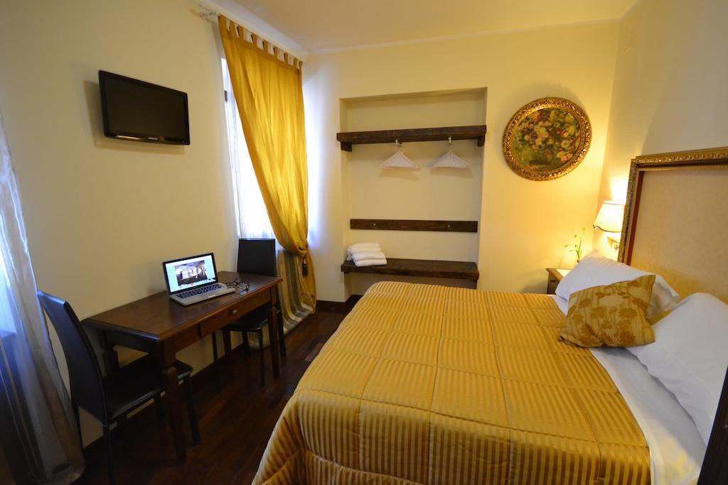 Case Brizi Asís Habitación foto
